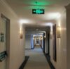 Hotel Corridor with Fire Safety Doors and Emergency Lighting