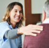 Supported Living scheme tenant having a chat with one of the helpers